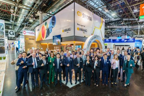 SIKORA_K 2025_booth and team.jpg